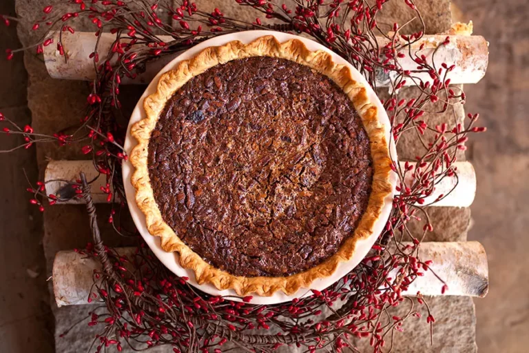 Smoked sweet potato pecan pie with decorative crust displayed overhead, made on a Hasty Bake Charcoal Grill