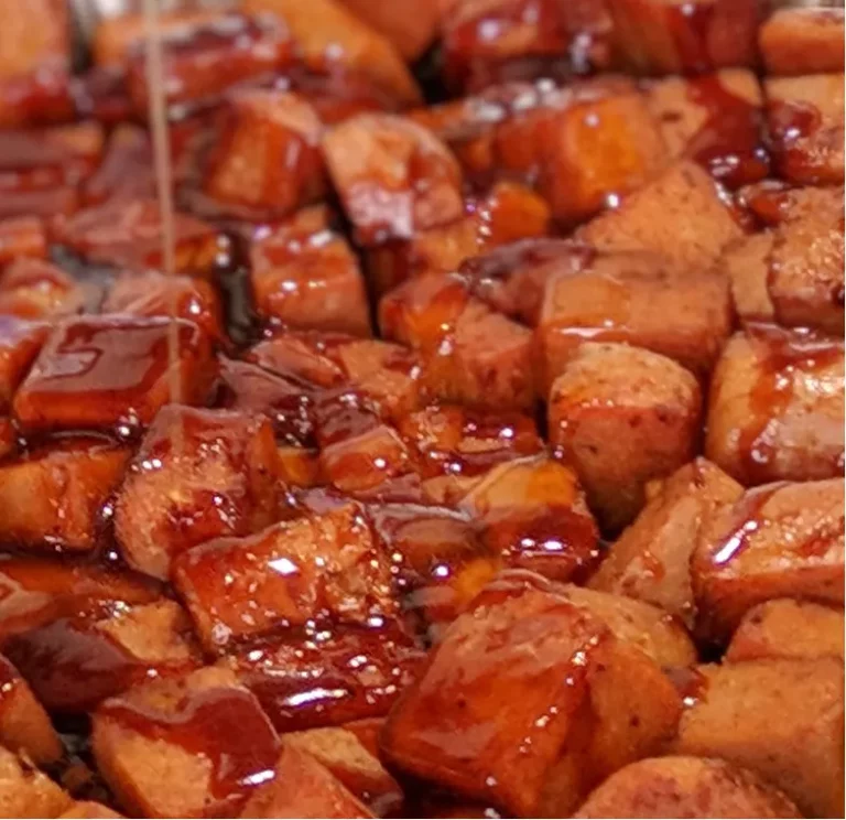 SPAM burnt ends glazed with caramelized BBQ sauce, made on a Hasty Bake Charcoal Grill